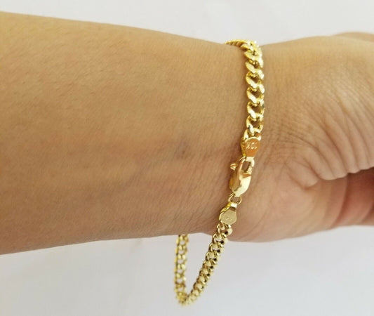 10k Yellow Gold Miami Cuban Bracelet 7" 5mm lobster lock men women hand chain - Reva Jeweler
