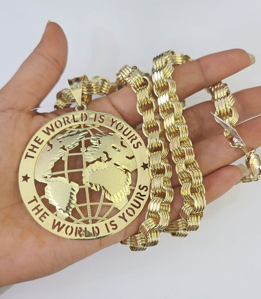 Side angle view of 10K gold "The World Is Yours" pendant on 9mm Byzantine chain