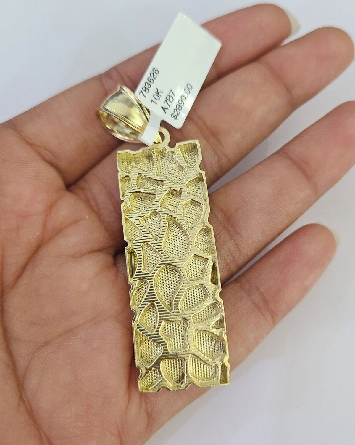 Full view of the Reva Jeweler 10k gold Cuban curb chain necklace with nugget pendant