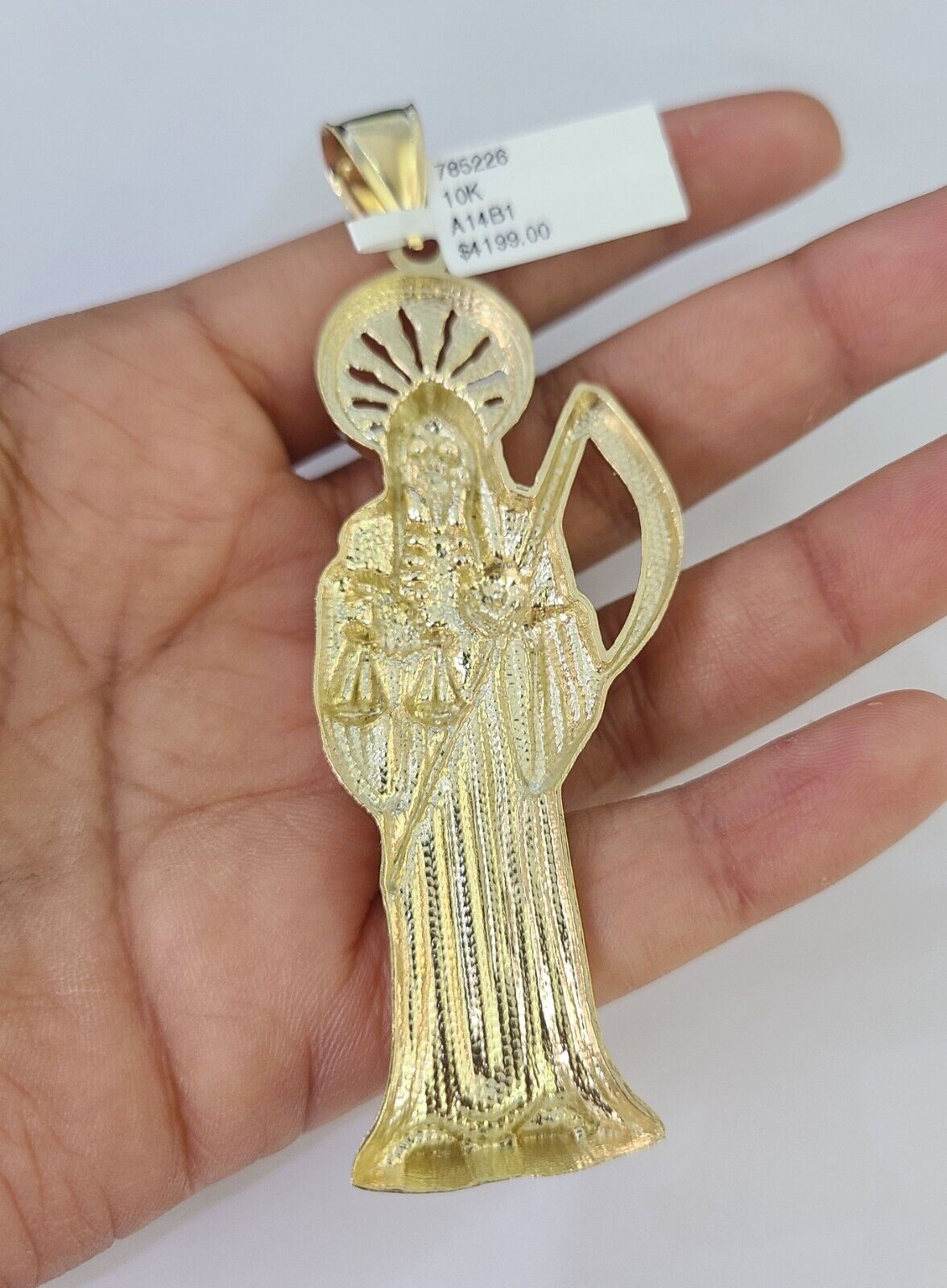 Full display of 10K yellow gold Franco chain with Saint Reaper pendant