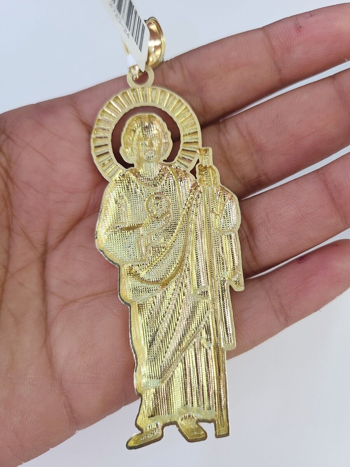 Front-facing view of Reva Jeweler 10K gold Saint Jude pendant and chain