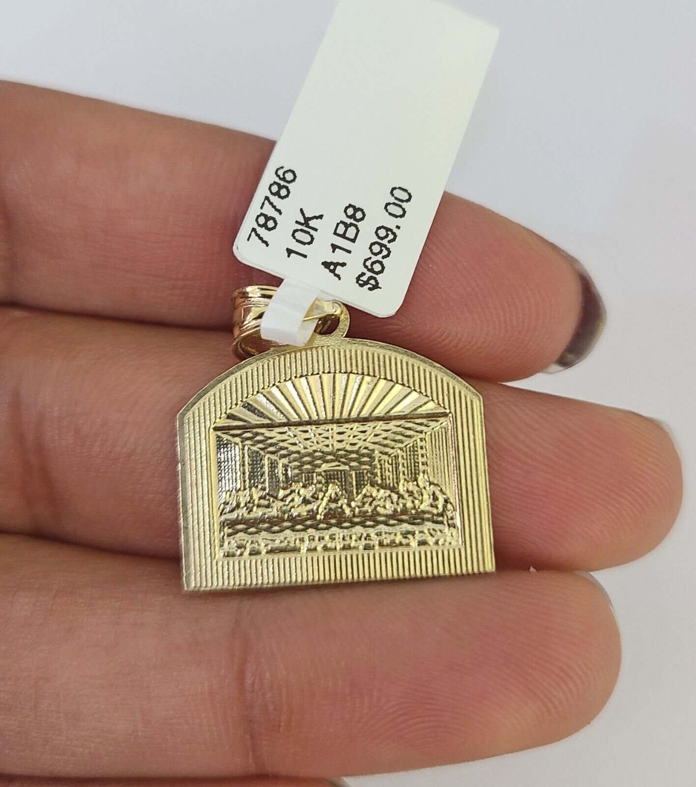 Detailed macro shot of 10K yellow gold Franco chain links