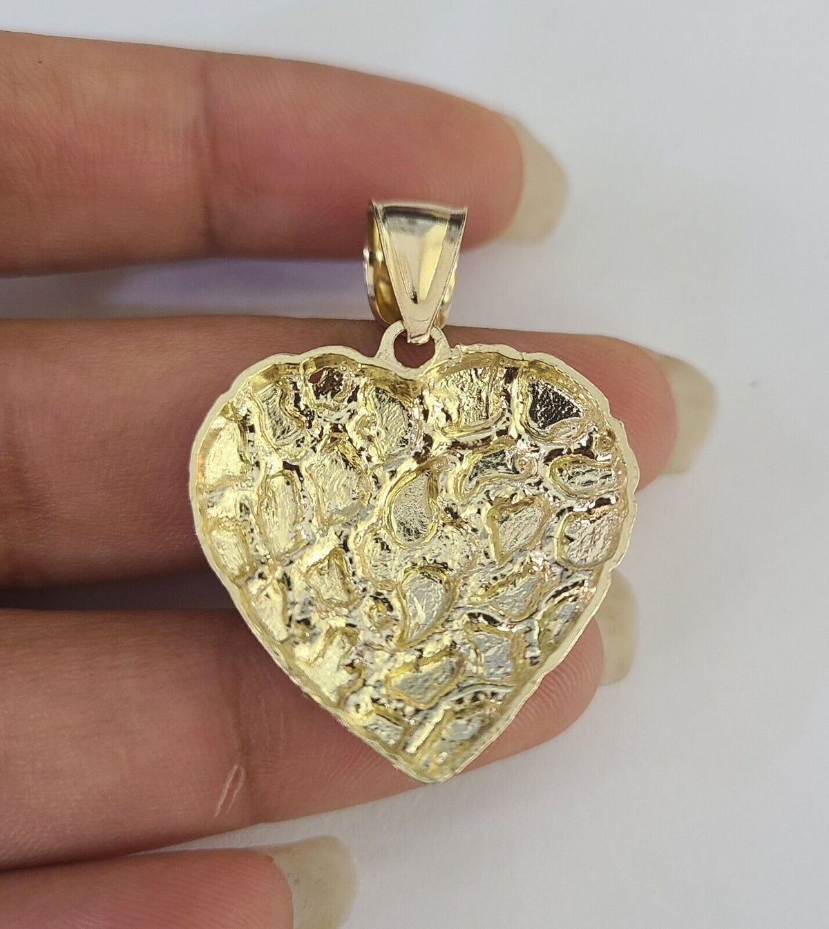 Model wearing heart pendant