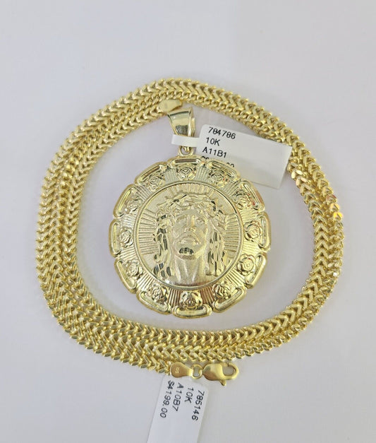 Flat lay display of Reva Jeweler 10K yellow gold Jesus and Mary necklace set