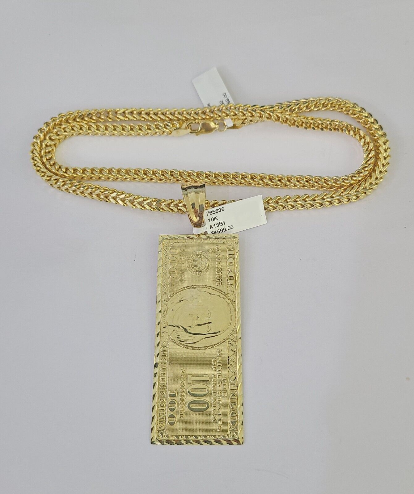 Front view of 10K yellow gold 100 dollar pendant necklace with Franco chain