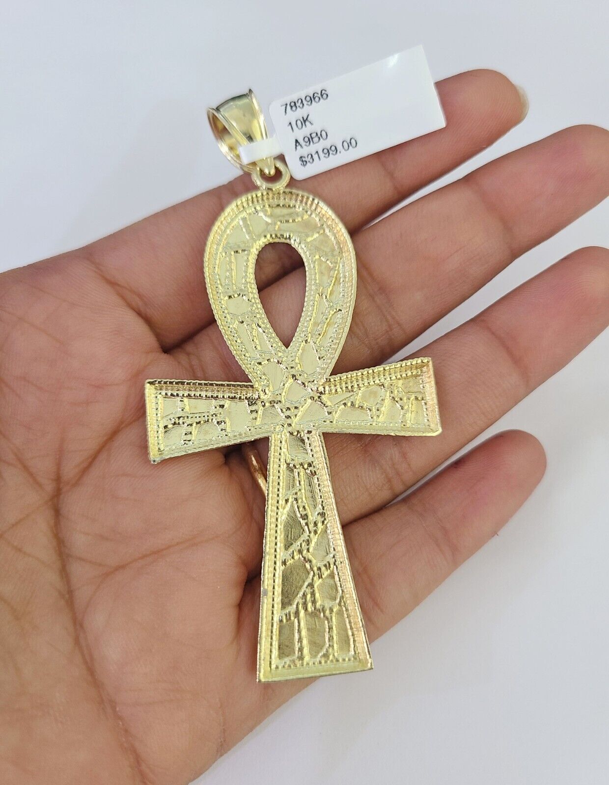 Side angle view of Franco chain necklace featuring Jesus Ankh cross pendant charm