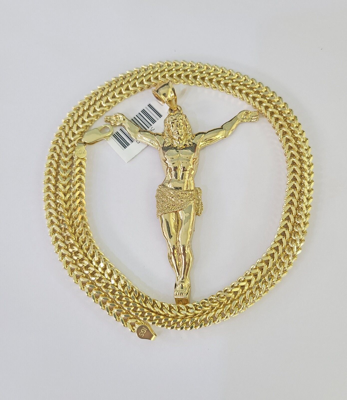 Side angle view of 10K yellow gold Jesus pendant on Franco chain
