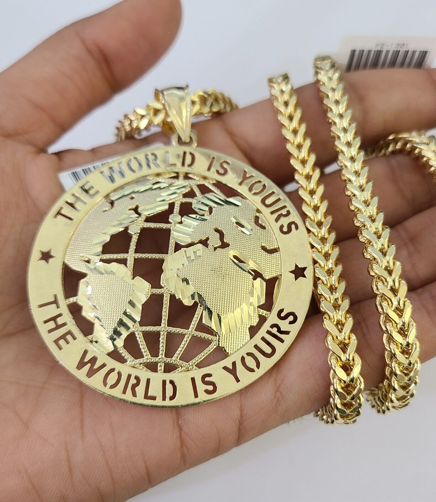 10K gold "The World Is Yours" pendant and Franco chain necklace set by Reva Jeweler