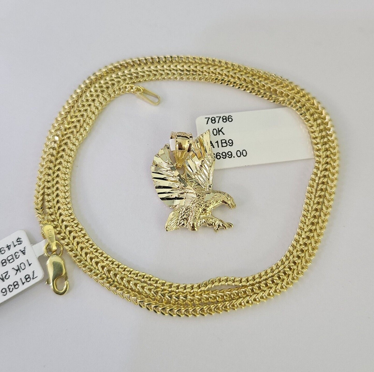 Close-up of 10K yellow gold eagle pendant on Franco chain necklace