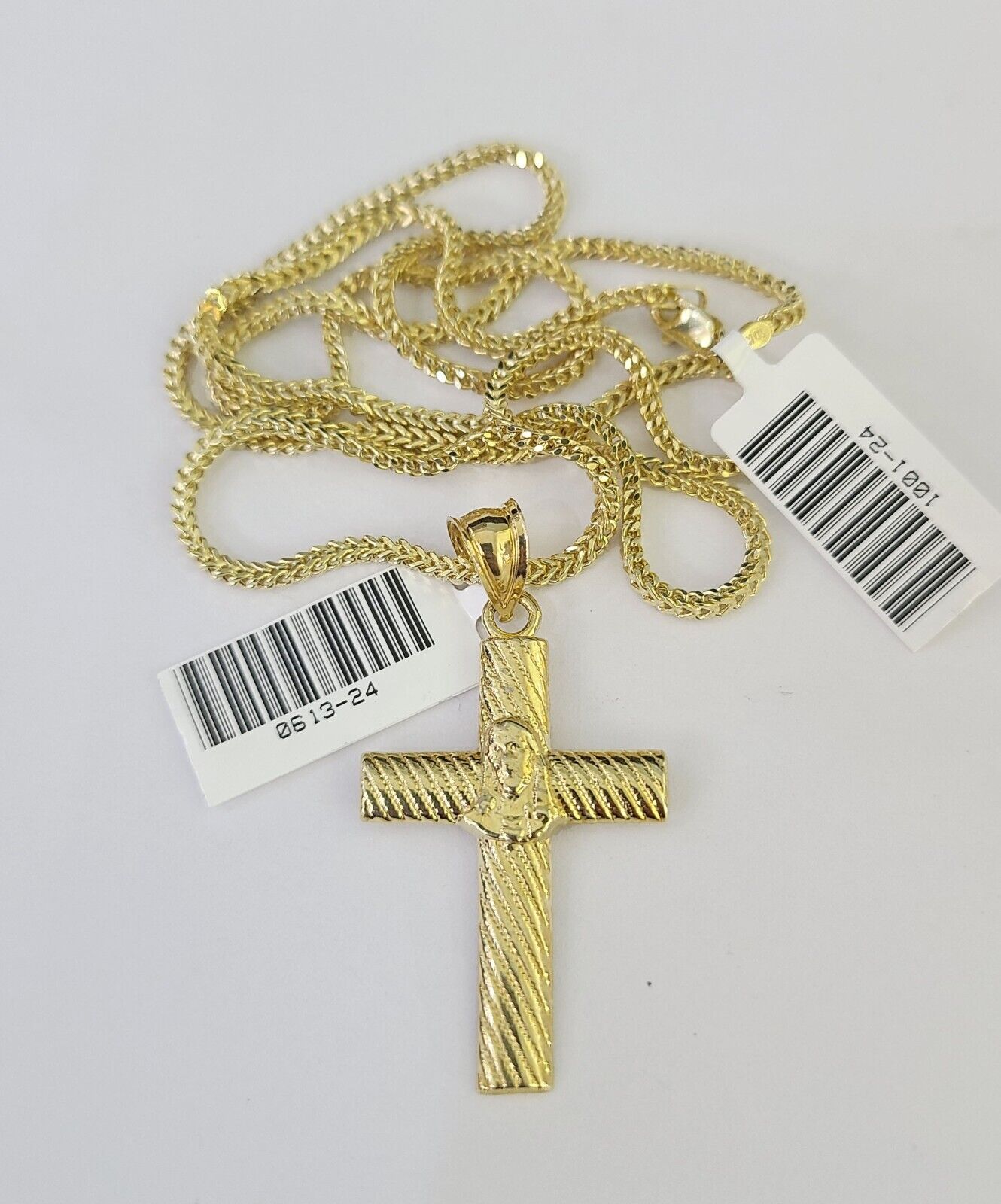 10K gold Franco chain necklace with Jesus cross pendant charm by Reva Jeweler