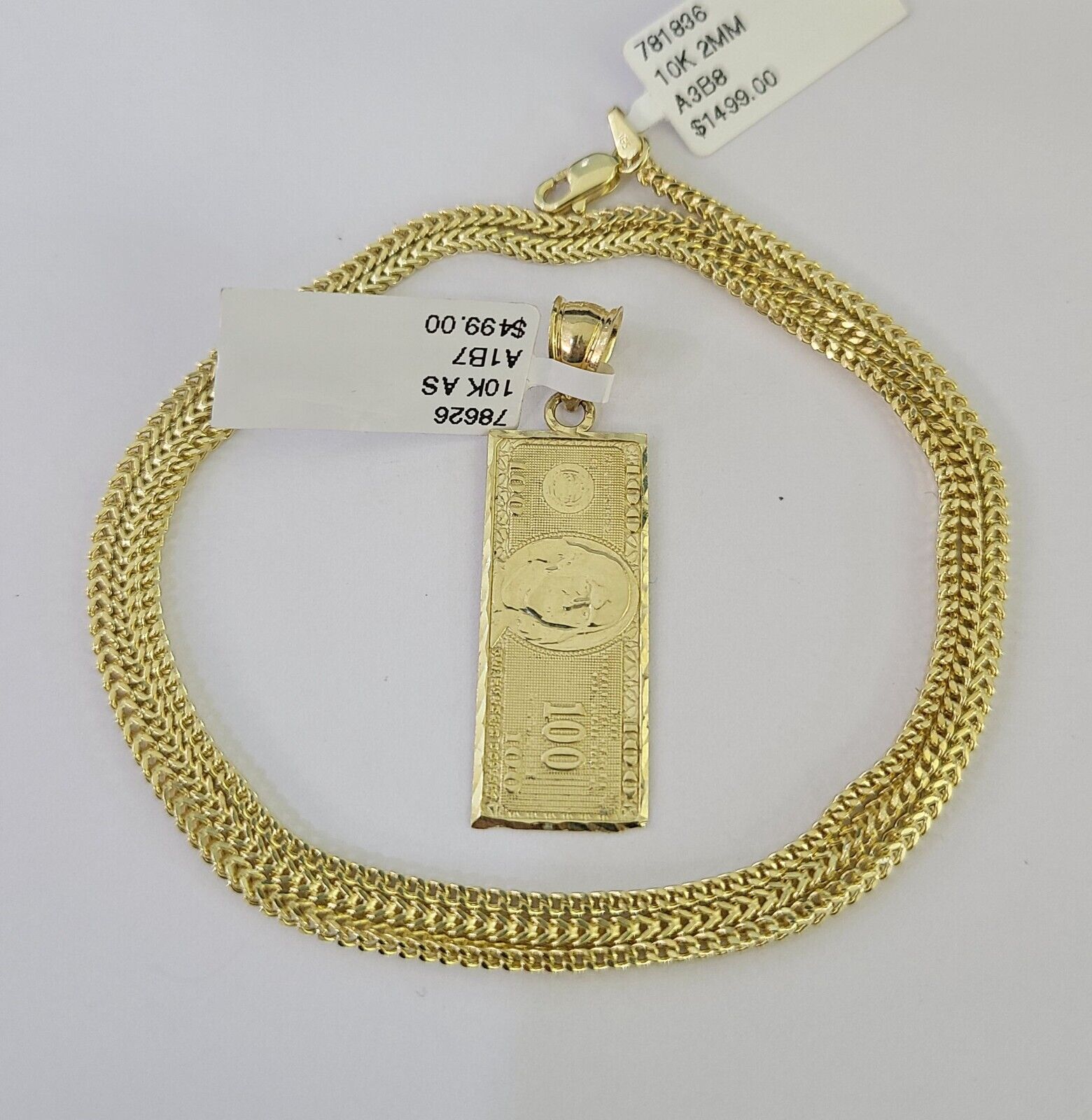 10K yellow gold Franco chain necklace with dollar sign pendant detail