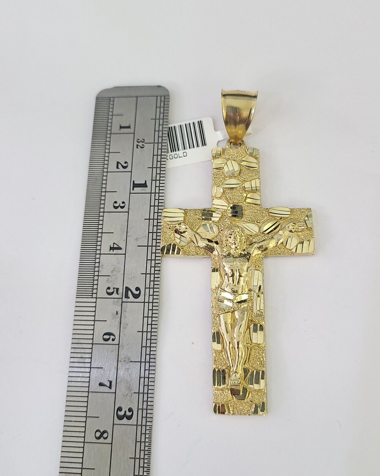 Front view of Jesus cross pendant necklace in 10K gold with Franco chain