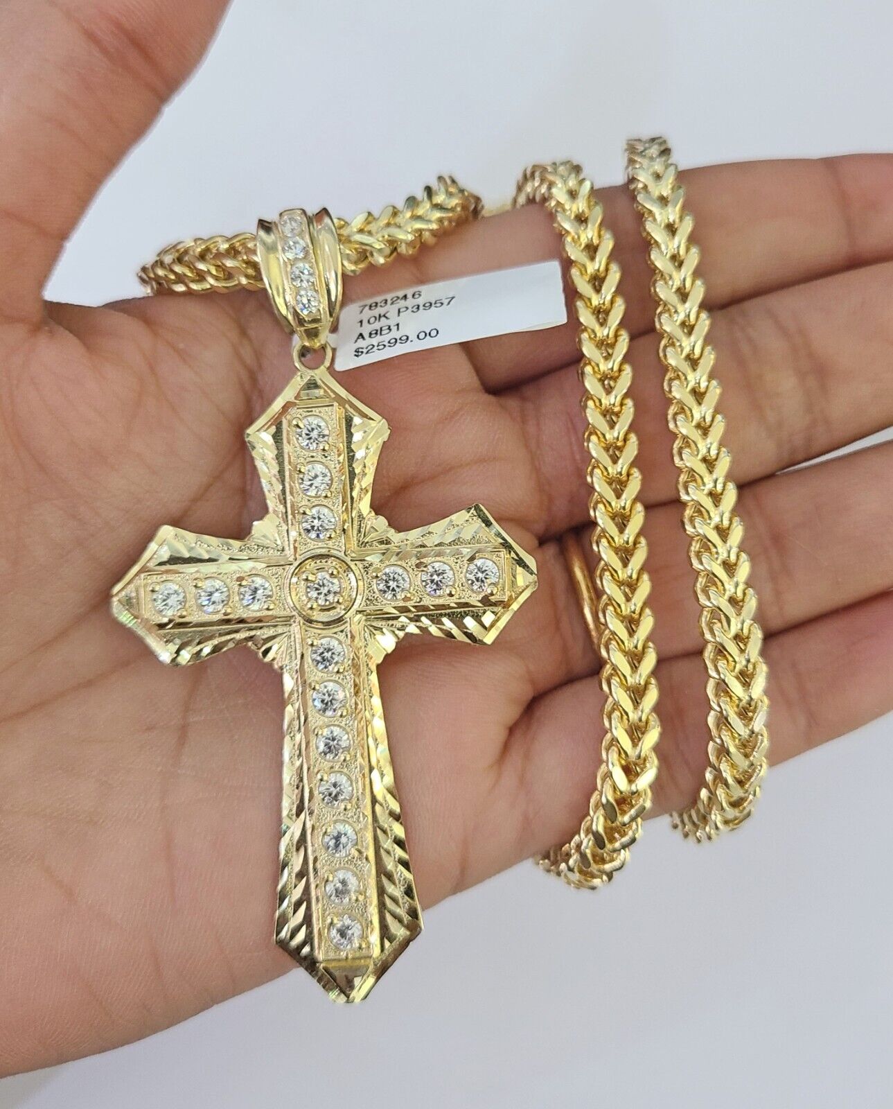 Side angle view of Franco chain necklace featuring Jesus cross pendant charm