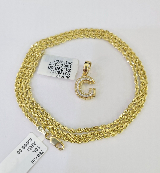 G initial pendant flat lay