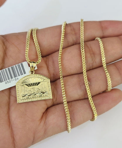 Full display of 10K yellow gold Franco chain with Last Supper pendant