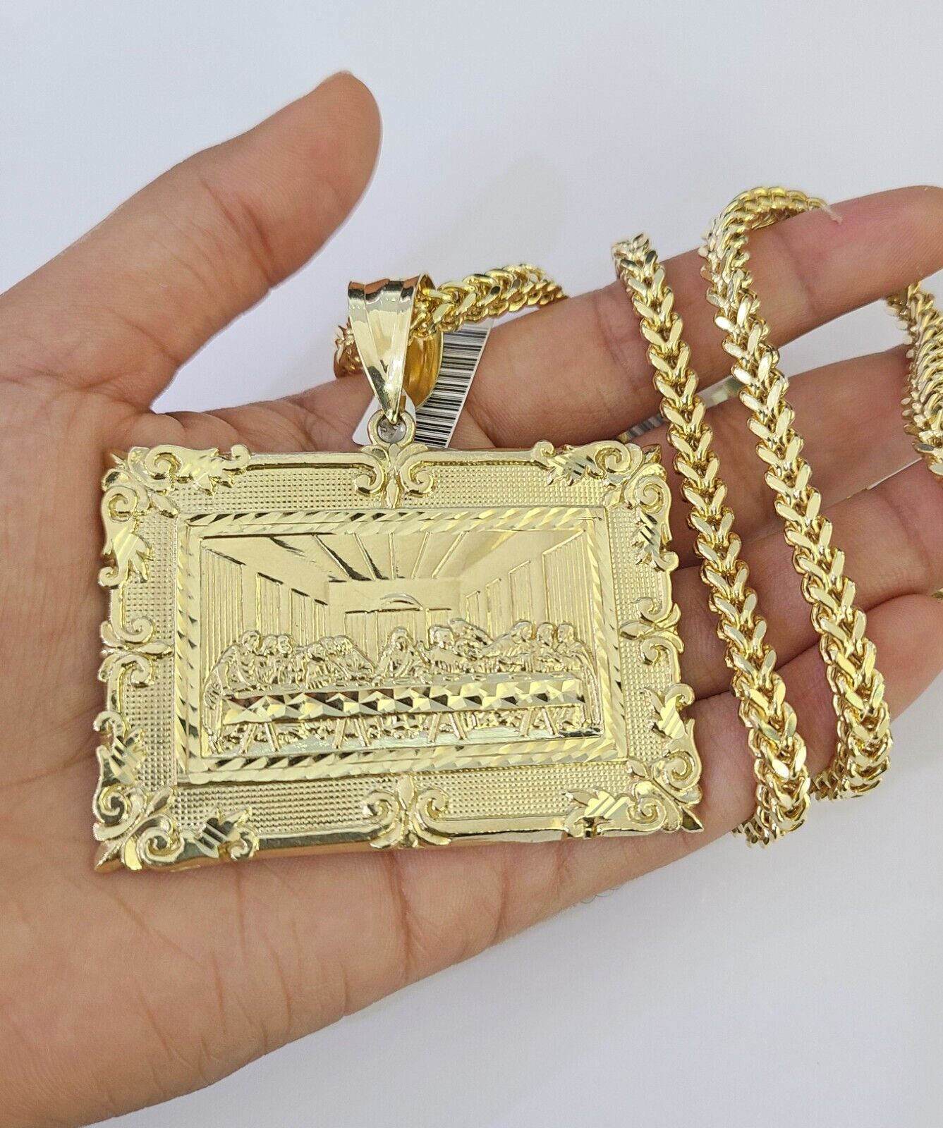 Front-facing view of Reva Jeweler 10K gold Last Supper pendant and chain