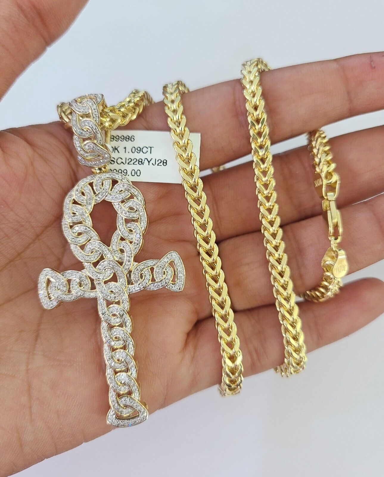 Side angle of Franco chain necklace featuring diamond Jesus cross pendant