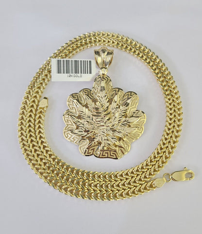 Front-facing view of Reva Jeweler 10K gold weed leaf pendant and chain