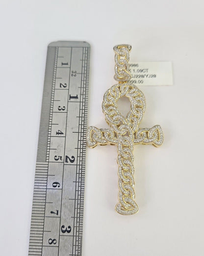 Close-up of 10K yellow gold diamond Jesus cross pendant on Franco chain