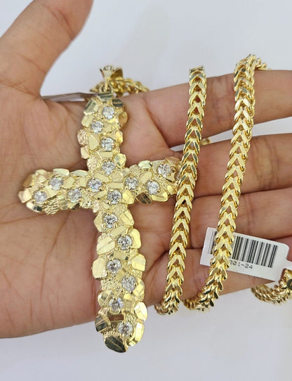 Flat lay display of Reva Jeweler 10K yellow gold necklace set
