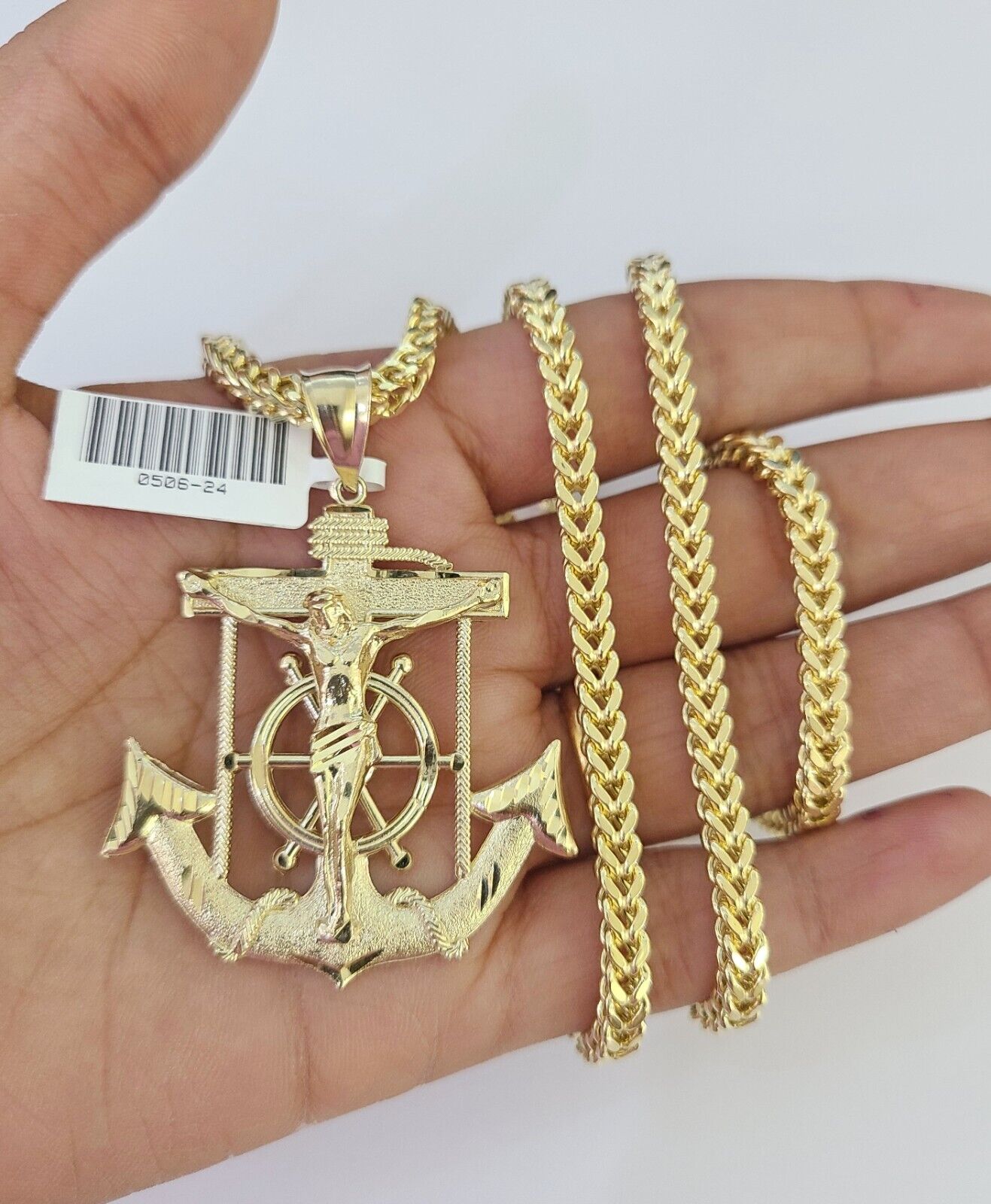 Side angle view of Franco chain necklace featuring Jesus anchor pendant charm