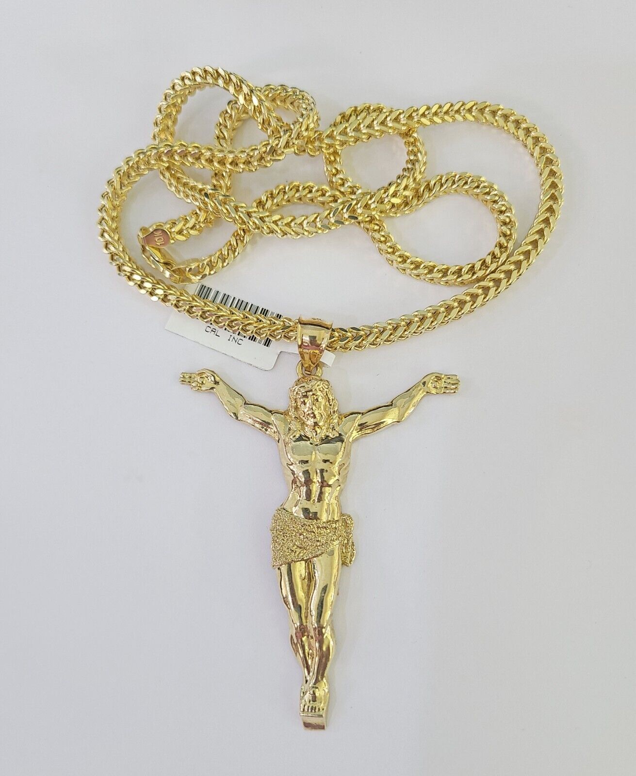 Close-up detailed view of 10K yellow gold Jesus pendant charm
