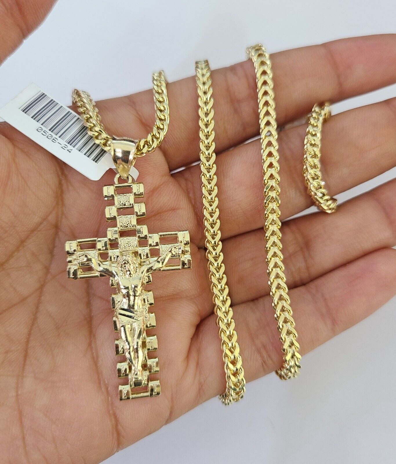 Front view of Jesus cross pendant necklace in 10K gold with Franco chain