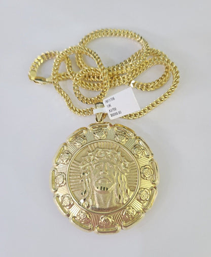 Flat lay display of Reva Jeweler 10K yellow gold Jesus and Virgin Mary necklace set