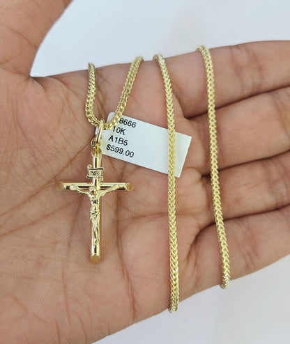 Close-up detail of INRI engraving on Jesus cross pendant in 10K gold