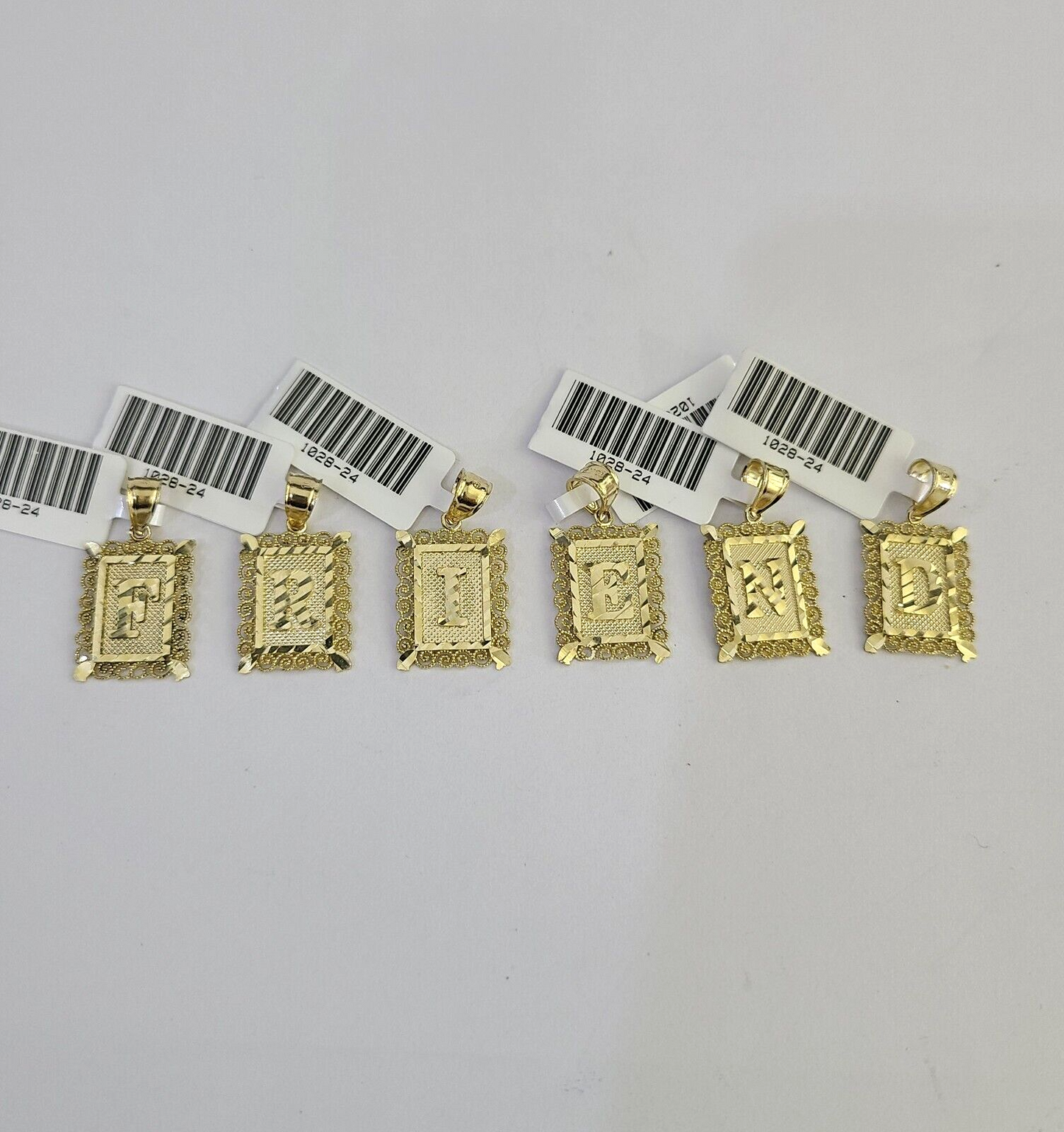 Front view of gold letter charm
