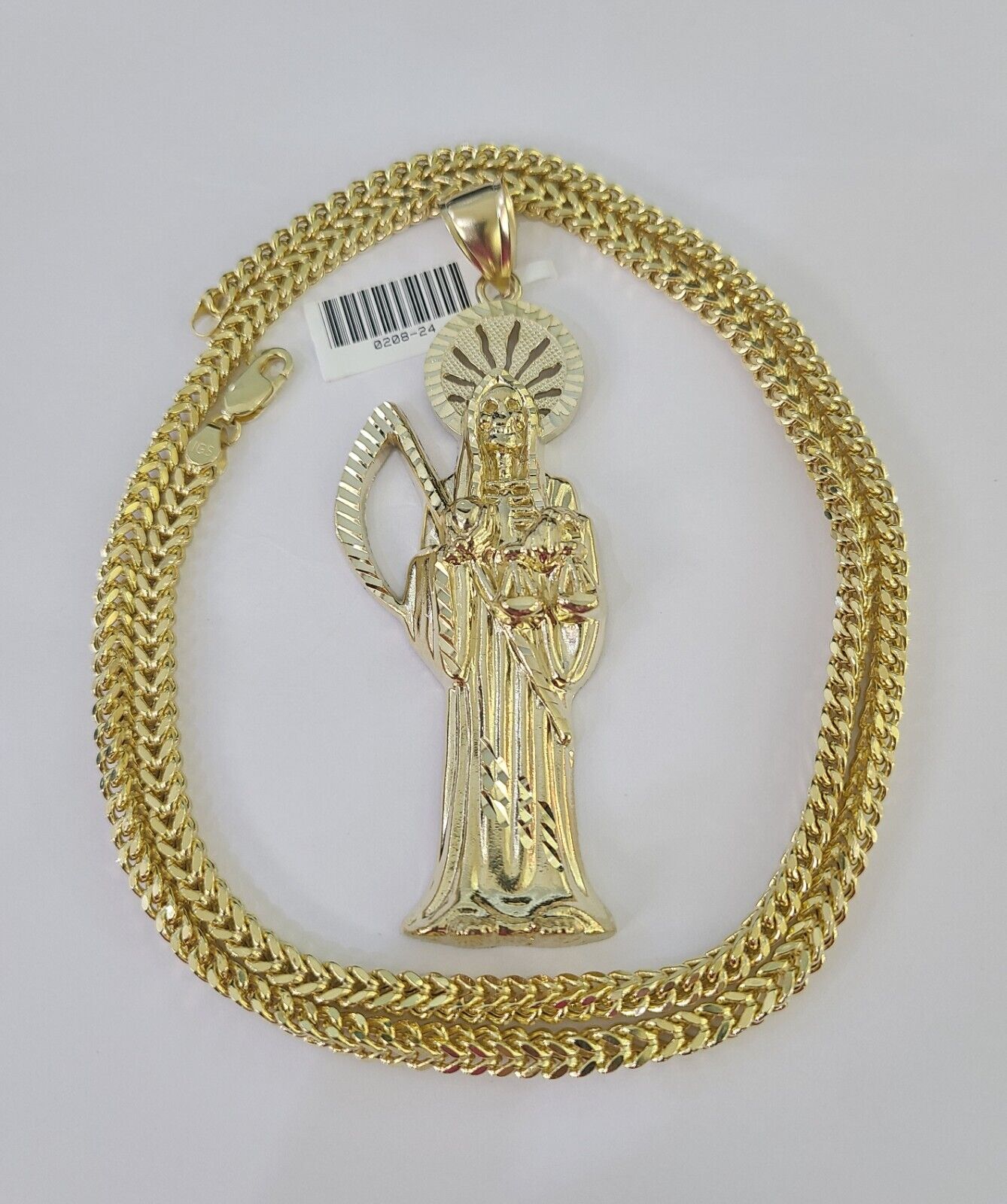 10K yellow gold Saint Reaper pendant and Franco chain necklace set by Reva Jeweler