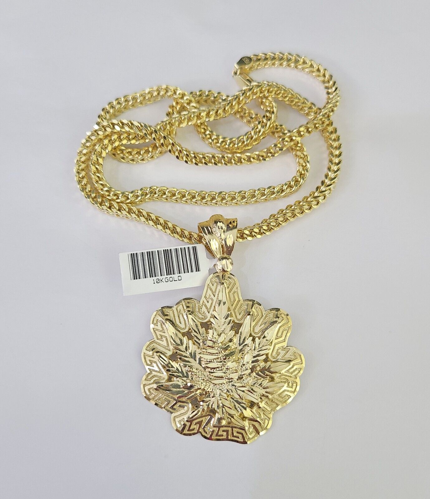 Detailed macro shot of 10K yellow gold Franco chain links