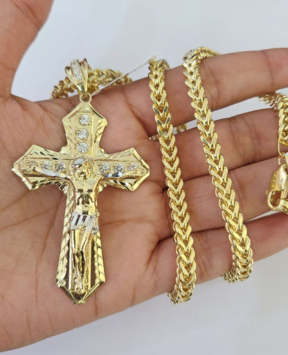 Side angle perspective of the 10K yellow gold Jesus cross pendant