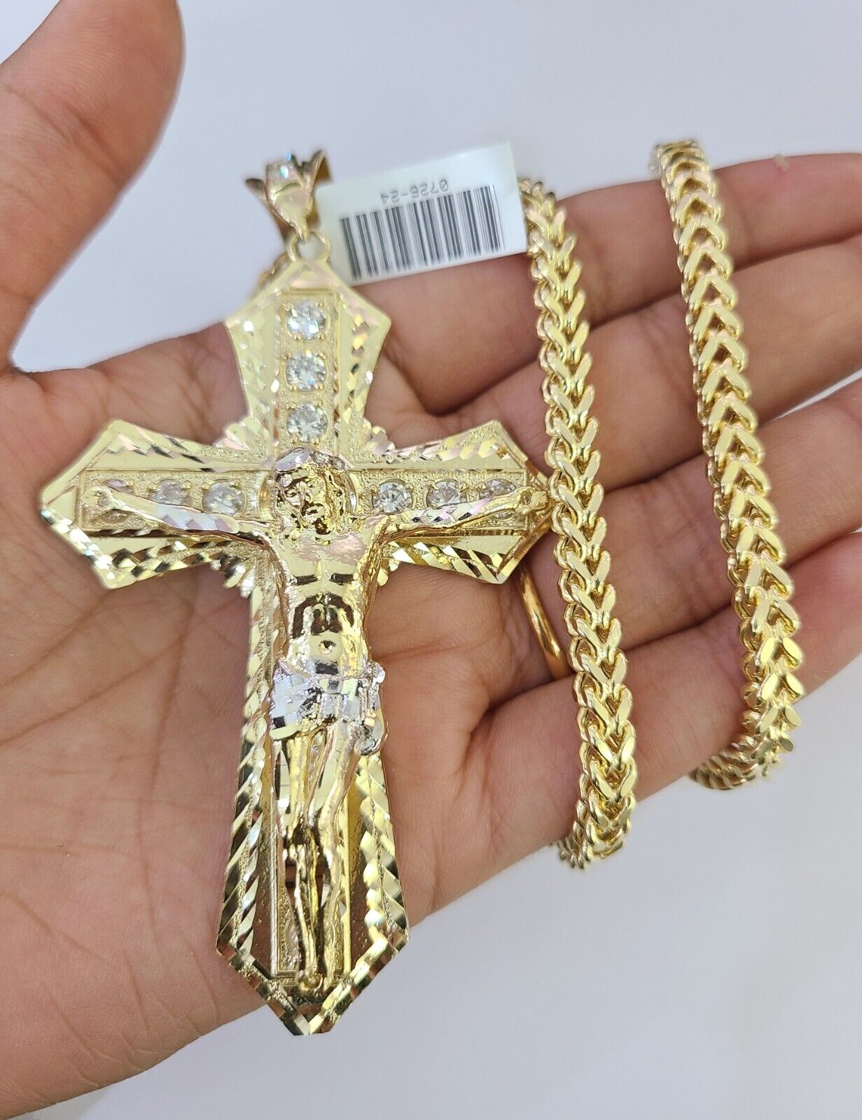 10K yellow gold Jesus cross necklace with Franco chain by Reva Jeweler