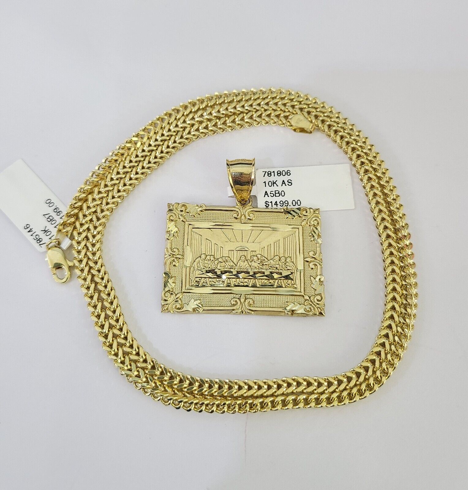 Side angle view of 10K yellow gold Last Supper pendant on Franco chain