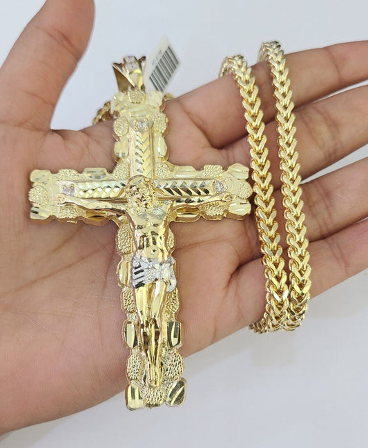 Side angle view of 10K yellow gold Jesus cross pendant on Franco chain