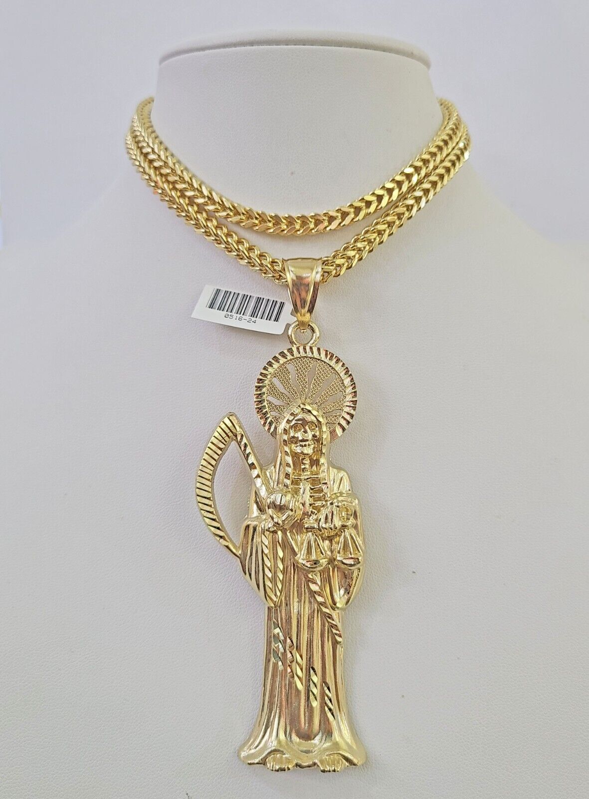 Full display of 10K yellow gold Franco chain with Saint Reaper pendant