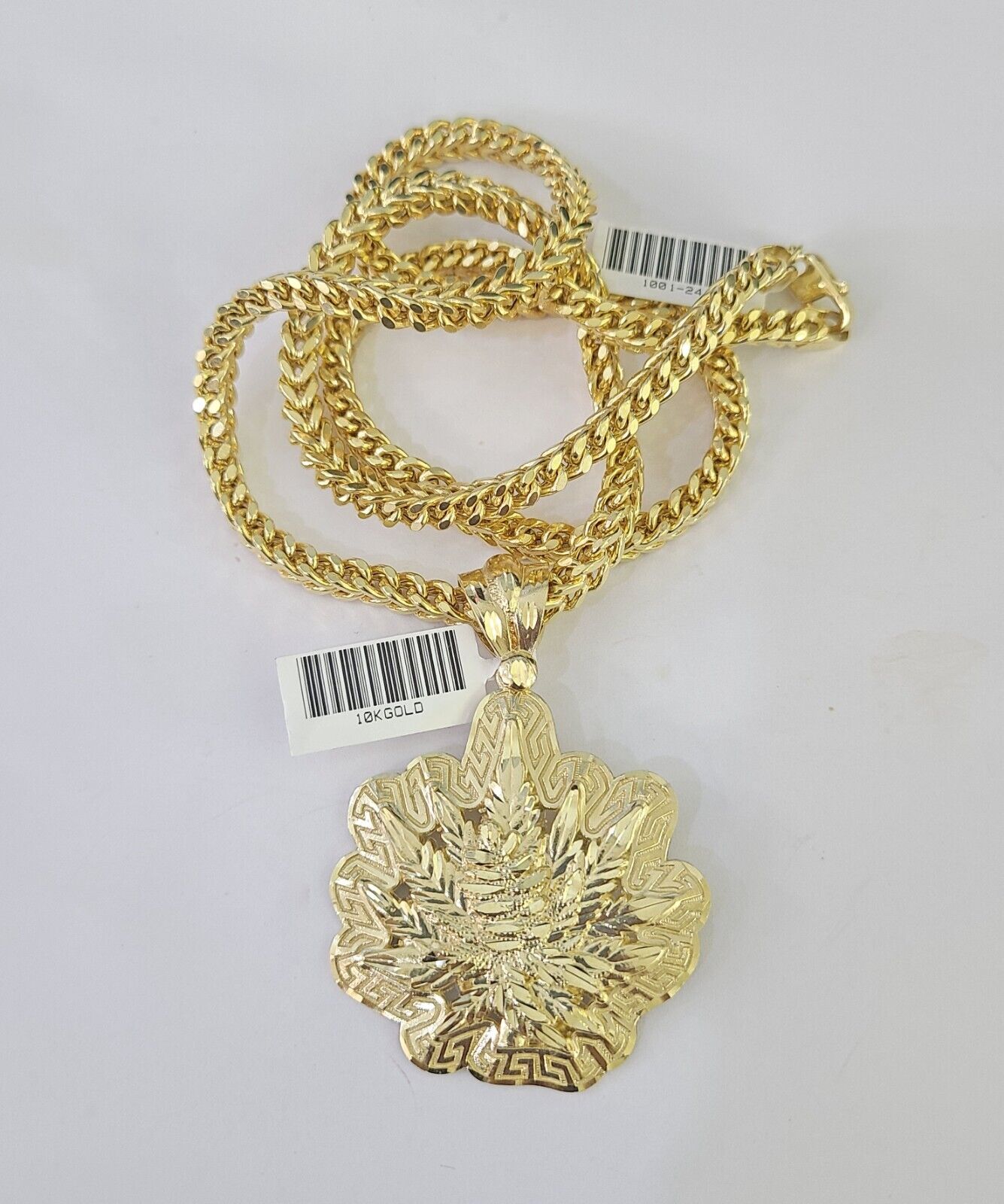 10K yellow gold tree leaf pendant and Franco chain necklace set by Reva Jeweler