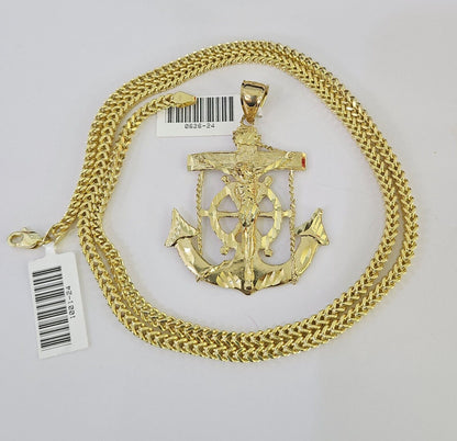 Close-up detail of Jesus anchor pendant in 10K gold jewelry design
