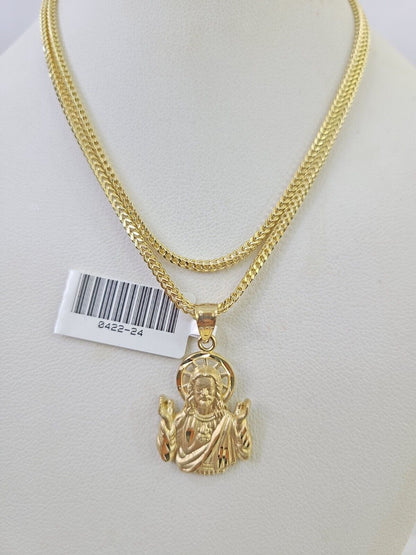 Flat lay display of Reva Jeweler 10K yellow gold Jesus necklace set