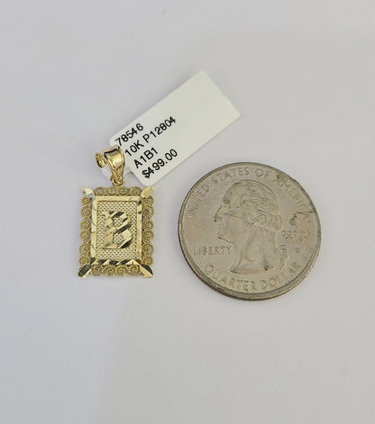 Gold initial pendant studio view