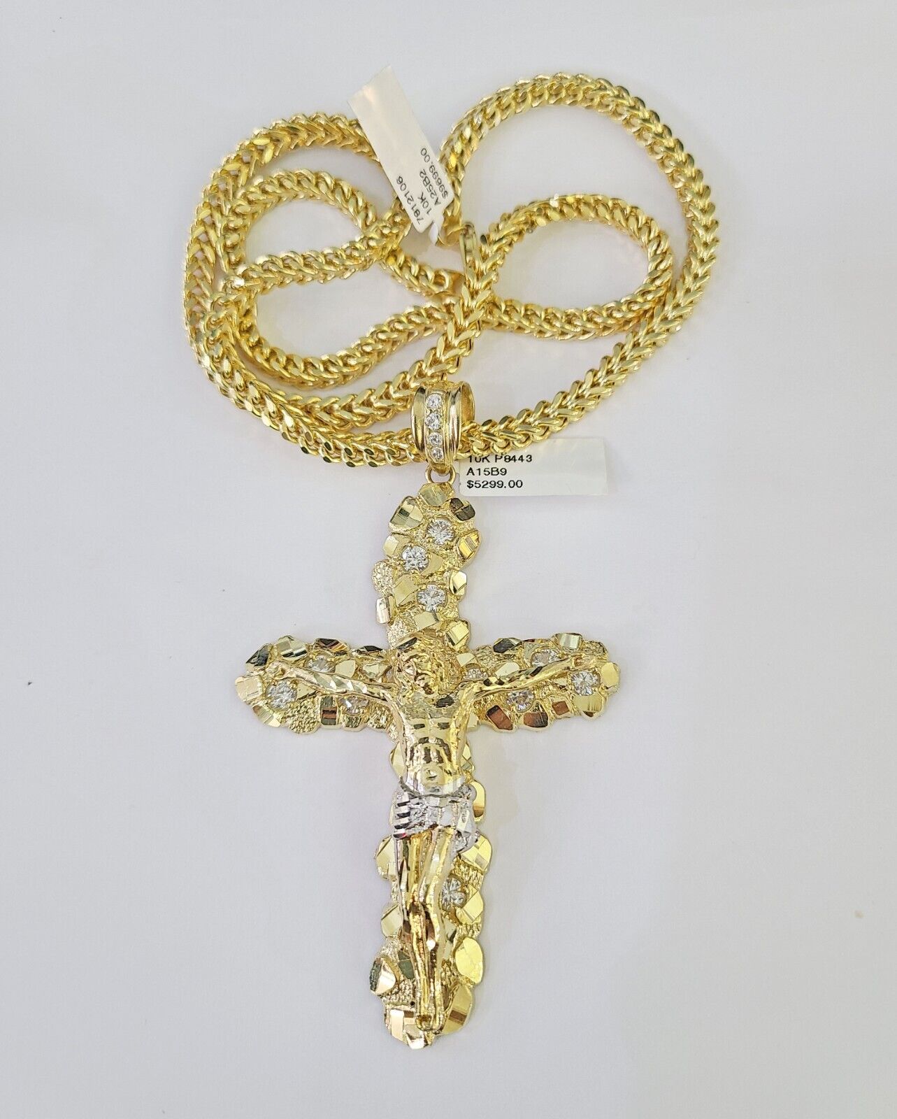 Flat lay display of the Reva Jeweler 10K yellow gold necklace set