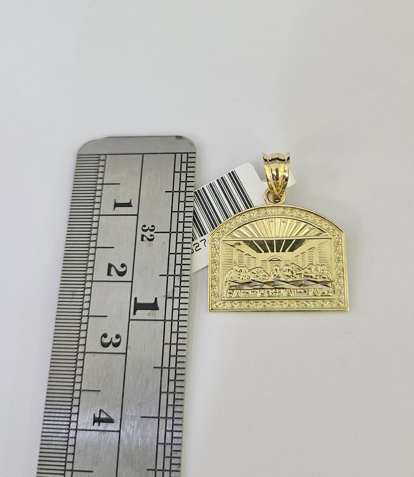 Front-facing view of Reva Jeweler 10K gold Last Supper pendant and chain