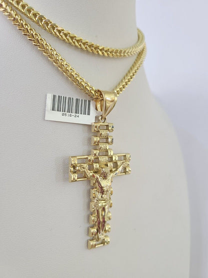 Front-facing view of Reva Jeweler 10K gold crucifix cross pendant and chain