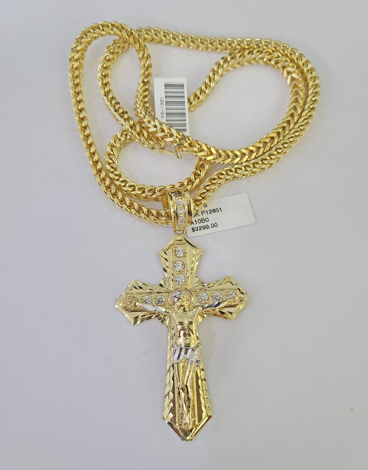 Close-up detailed view of the 10K yellow gold Jesus cross pendant