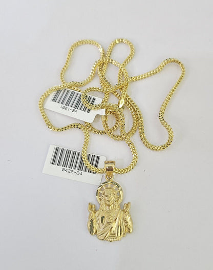 Full display of 10K yellow gold Franco chain with Jesus pendant