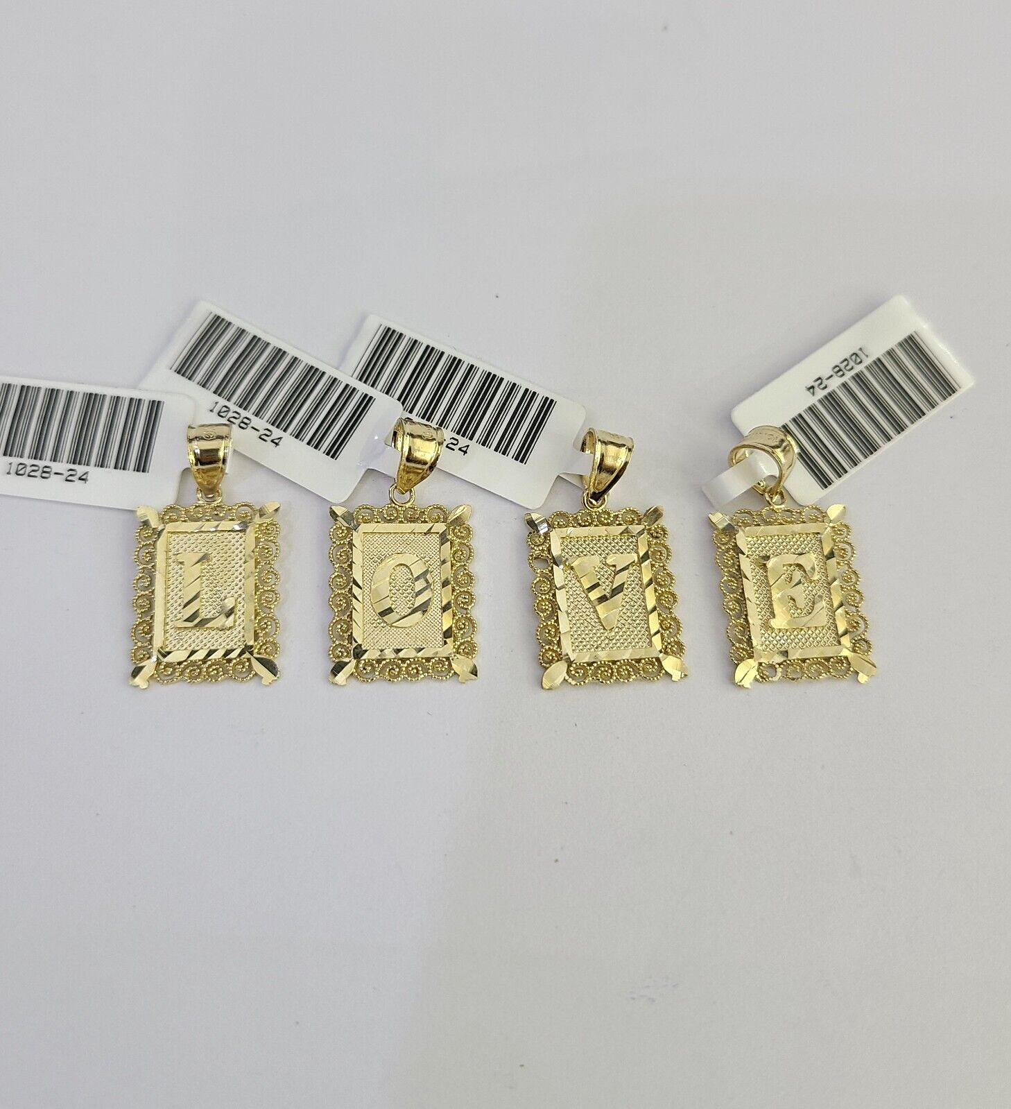 Gold letter charm bail detail