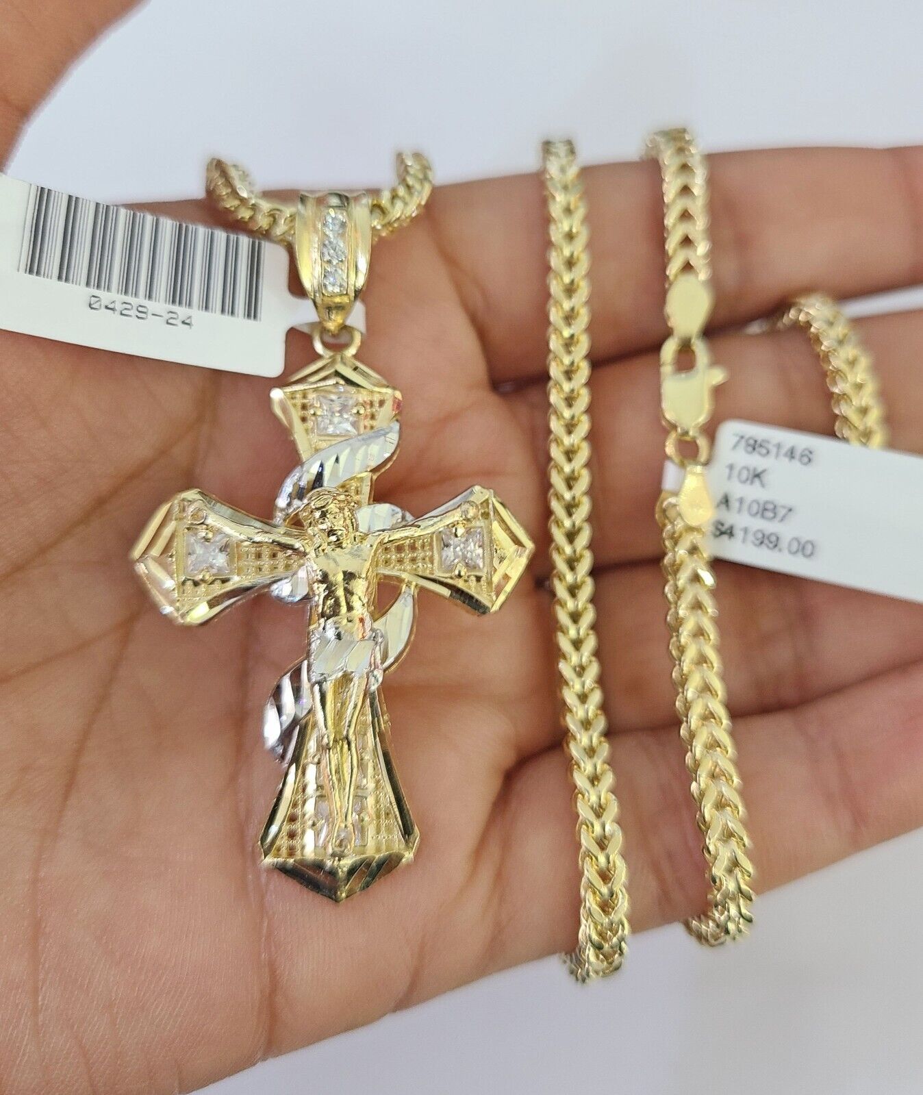 Side angle view of Franco chain necklace featuring Jesus cross pendant charm