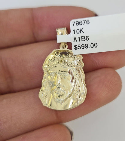 Full display of 10K yellow gold Franco chain with Jesus head pendant