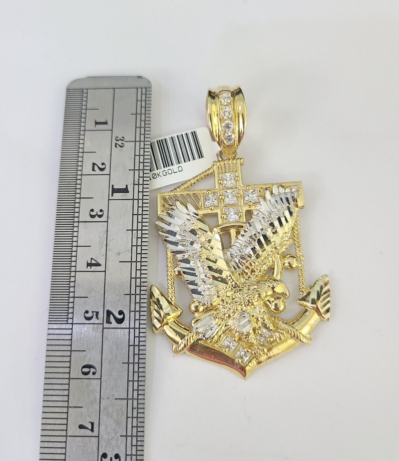Close-up of 10K yellow gold eagle anchor pendant on Franco chain necklace